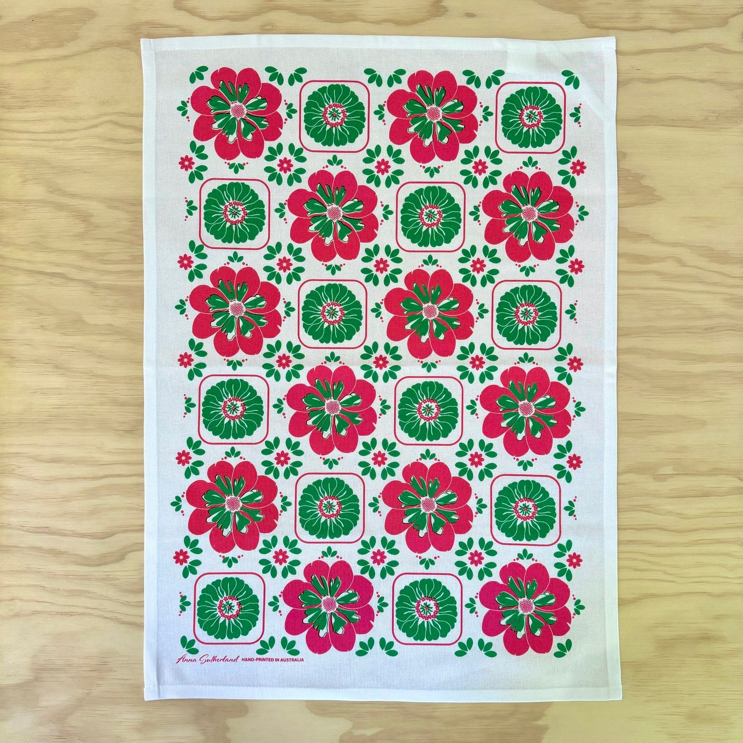 Floral patterned towel on a wooden surface