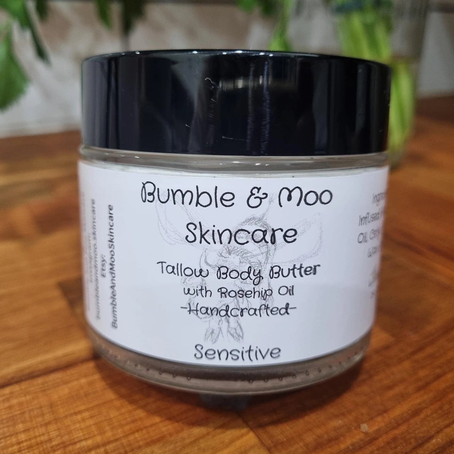 Jar of Bumble & Moo Skincare Tallow Body Butter on a wooden surface