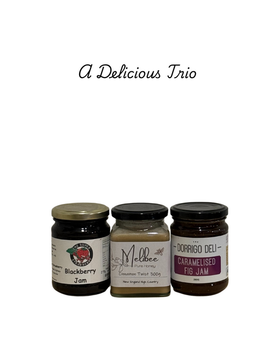 Three jars of jam with labels on a white background, featuring text 'A Delicious Trio'.