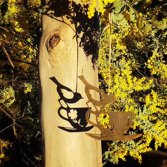 Lasercut garden art bird in a teacup