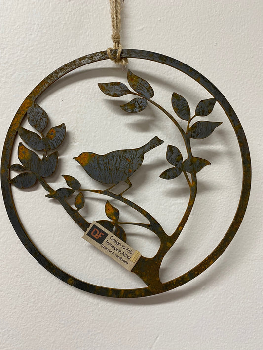 laser cut garden art bird in a circle